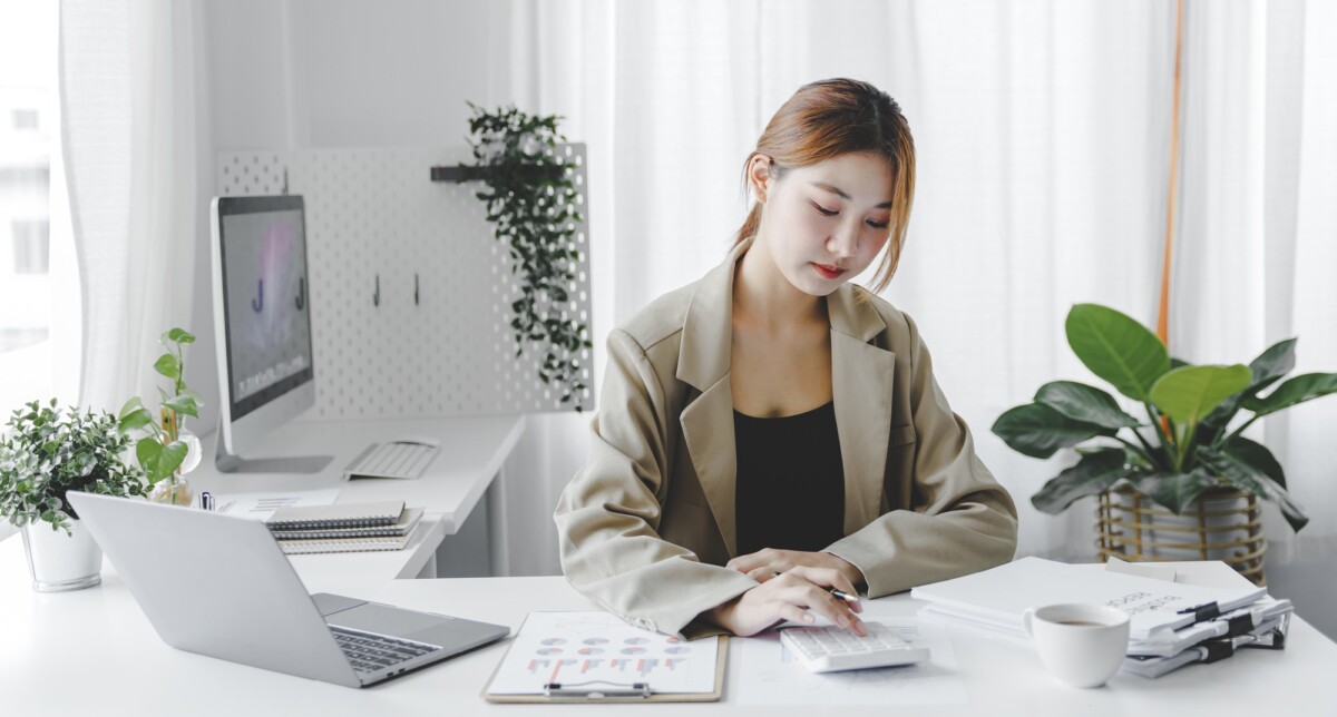 Teamwork with price chart analyzes business people on the table at the conference room.