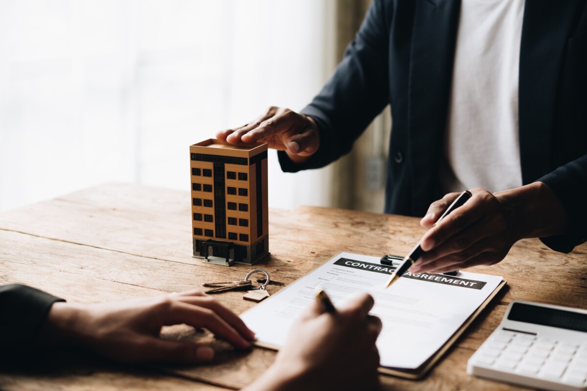 Real estate agent talked about the terms of the home purchase agreement.